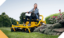 Woman riding a lawn mower